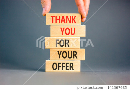 Thank you for your offer symbol. Concept words Thank you for your offer on beautiful wooden blocks. Beautiful grey background. Businessman hand. Business thank you for your offer concept. Copy space Thank you for your offer symbol. Concept words Thank you for your offer on beautiful wooden blocks. Beautiful grey background. Businessman hand. Business thank you for your offer concept. Copy space 141367685