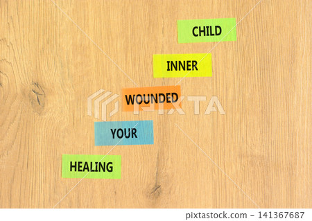 Healing your wounded inner child symbol. Concept words Healing your wounded inner child on beautiful colored papers. Beautiful wooden background. Psychological Healing inner child concept. Copy space. Healing your wounded inner child symbol. Concept words Healing your wounded inner child on beautiful colored papers. Beautiful wooden background. Psychological Healing inner child concept. Copy space. 141367687
