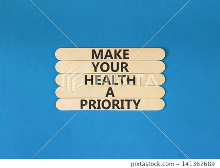 Make your health a priority symbol. Concept words Make your health a priority on beautiful wooden sticks. Beautiful blue background. Medical make your health a priority concept. Copy space. Make your health a priority symbol. Concept words Make your health a priority on beautiful wooden sticks. Beautiful blue background. Medical make your health a priority concept. Copy space. 141367689