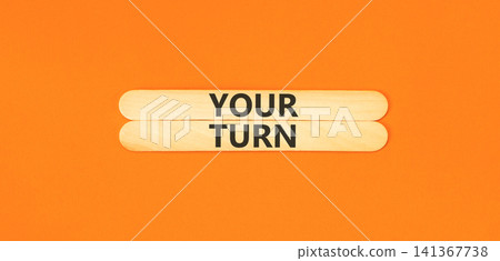 Your turn words symbol. Concept words Your turn on beautiful wooden sticks. Beautiful orange background. Business your turn motivational support concept. Copy space. Your turn words symbol. Concept words Your turn on beautiful wooden sticks. Beautiful orange background. Business your turn motivational support concept. Copy space. 141367738