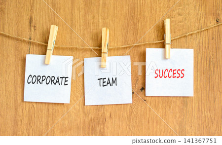 Corporate team success symbol. Concept words Corporate team success on beautiful white papers on wooden clothespin. Beautiful wooden background. Business corporate team success concept. Copy space. Corporate team success symbol. Concept words Corporate team success on beautiful white papers on wooden clothespin. Beautiful wooden background. Business corporate team success concept. Copy space. 141367751