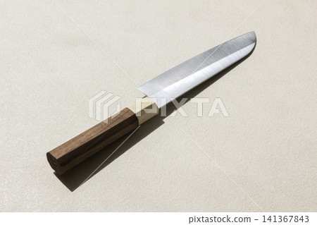 It is a kitchen knife placed against a white background. It is a kitchen knife placed against a white background. 141367843