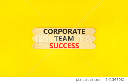 Corporate team success words symbol. Concept words Corporate team success on beautiful wooden sticks. Beautiful yellow background. Business corporate team success concept. Copy space. Corporate team success words symbol. Concept words Corporate team success on beautiful wooden sticks. Beautiful yellow background. Business corporate team success concept. Copy space. 141368081