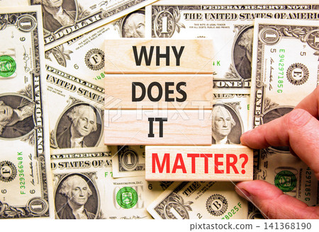 Why does it matter words symbol. Concept words Why does it matter on beautiful wooden blocks. Beautiful dollar bills background. Dollar bills. Business support why does it matter concept. Copy space. Why does it matter words symbol. Concept words Why does it matter on beautiful wooden blocks. Beautiful dollar bills background. Dollar bills. Business support why does it matter concept. Copy space. 141368190