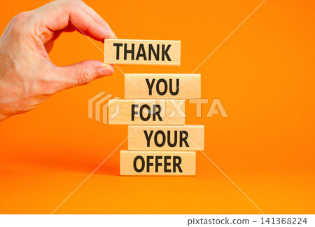 Thank you for your offer symbol. Concept words Thank you for your offer on beautiful wooden blocks. Beautiful orange background. Businessman hand. Business thank you for your offer concept. Copy space Thank you for your offer symbol. Concept words Thank you for your offer on beautiful wooden blocks. Beautiful orange background. Businessman hand. Business thank you for your offer concept. Copy space 141368224