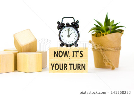 Now it's your turn symbol. Concept words Now it's your turn on beautiful wooden blocks. Beautiful white background. Alarm clock. Business Now it's your turn motivational support concept. Copy space. Now it's your turn symbol. Concept words Now it's your turn on beautiful wooden blocks. Beautiful white background. Alarm clock. Business Now it's your turn motivational support concept. Copy space. 141368253
