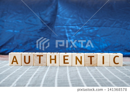 motivational word Authentic made of letters on wooden cubes motivational word Authentic made of letters on wooden cubes 141368578