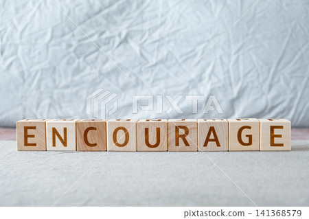 motivational word Encourage made of letters on wooden cubes 141368579