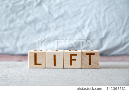 motivational word Lift made of letters on wooden cubes motivational word Lift made of letters on wooden cubes 141368581