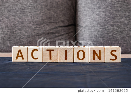 motivational word Actions made of letters on wooden cubes motivational word Actions made of letters on wooden cubes 141368635