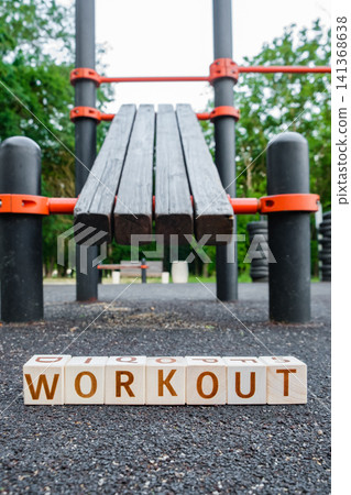 motivational word Workout made of letters on wooden cubes 141368638