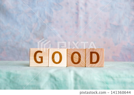 motivational word Good made of letters on wooden cubes motivational word Good made of letters on wooden cubes 141368644