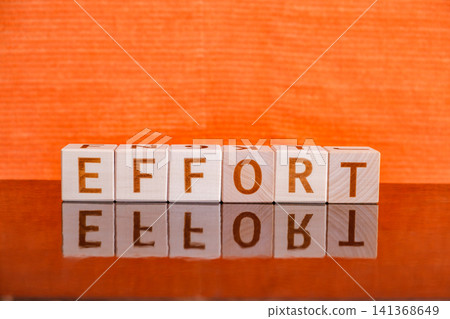 motivational word Effort made of letters on wooden cubes motivational word Effort made of letters on wooden cubes 141368649