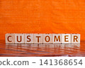 motivational word Customer made of letters on wooden cubes 141368654