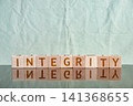 motivational word Integrity made of letters on wooden cubes 141368655