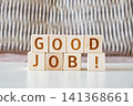motivational phrase Good Job! made of letters on wooden cubes 141368661