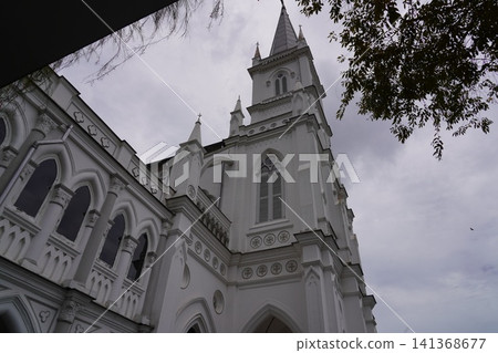 Majestic White Church Against a Gray Sky 141368677