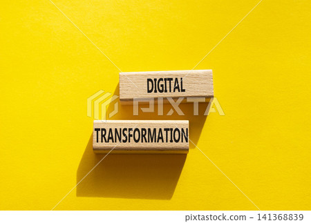 Digital transformation symbol. Concept word Digital transformation on wooden blocks. Beautiful yellow background. Business and Digital transformation concept. Copy space Digital transformation symbol. Concept word Digital transformation on wooden blocks. Beautiful yellow background. Business and Digital transformation concept. Copy space 141368839