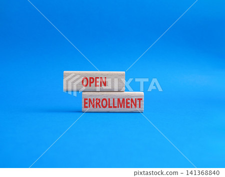Open Enrollment symbol. Wooden blocks with words Open Enrollment. Beautiful blue background. Business and Open Enrollment concept. Copy space. Open Enrollment symbol. Wooden blocks with words Open Enrollment. Beautiful blue background. Business and Open Enrollment concept. Copy space. 141368840
