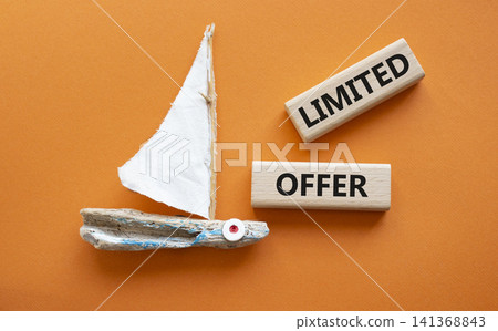 Limited offer symbol. Concept word Limited offer on wooden blocks. Beautiful orange background with boat. Business and Limited offer concept. Copy space Limited offer symbol. Concept word Limited offer on wooden blocks. Beautiful orange background with boat. Business and Limited offer concept. Copy space 141368843