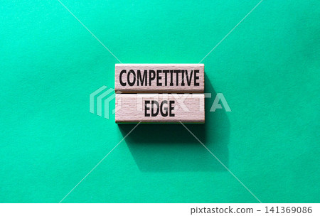 Competitive edge symbol. Concept word Competitive edge on wooden blocks. Beautiful green background. Business and Competitive edge concept. Copy space Competitive edge symbol. Concept word Competitive edge on wooden blocks. Beautiful green background. Business and Competitive edge concept. Copy space 141369086