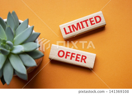 Limited offer symbol. Concept word Limited offer on wooden blocks. Beautiful orange background with succulent plant. Business and Limited offer concept. Copy space Limited offer symbol. Concept word Limited offer on wooden blocks. Beautiful orange background with succulent plant. Business and Limited offer concept. Copy space 141369108