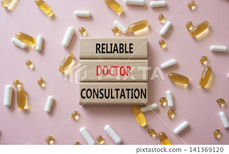 Reliable doctor consultation symbol. Concept words Reliable doctor consultation on wooden blocks. Beautiful pink background with pills. Healthcare and Reliable doctor consultation concept. Copy space. Reliable doctor consultation symbol. Concept words Reliable doctor consultation on wooden blocks. Beautiful pink background with pills. Healthcare and Reliable doctor consultation concept. Copy space. 141369120