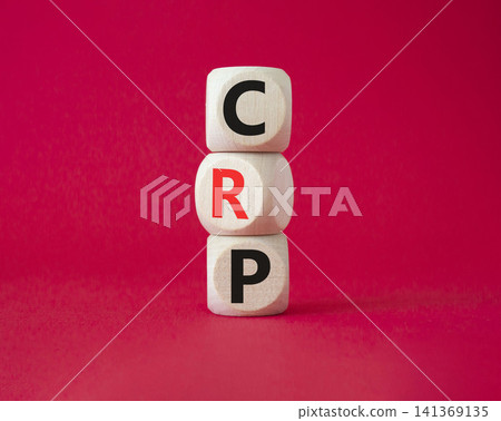 CRP - C-Reactive Protein Test symbol. Wooden cubes with word CRP. Beautiful red background. Medical and C-Reactive Protein Test concept. Copy space. CRP - C-Reactive Protein Test symbol. Wooden cubes with word CRP. Beautiful red background. Medical and C-Reactive Protein Test concept. Copy space. 141369135