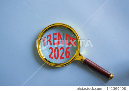 Trends 2026 symbol. Magnifying Glass with words Trends 2026. Beautiful blue background. Business and Trends 2026 concept. Copy space. Trends 2026 symbol. Magnifying Glass with words Trends 2026. Beautiful blue background. Business and Trends 2026 concept. Copy space. 141369408