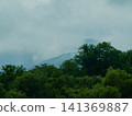 It rained all day, but in the afternoon water vapor rose along the mountainside, and the sun came out. 141369887