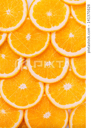 Bright and juicy fresh sliced orange background texture 141370826