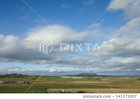 Rural Spanish Countryside with Dramatic Clouds and Distant Village Rural Spanish Countryside with Dramatic Clouds and Distant Village 141371007