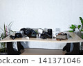 Interior of studio with photographer's workplace, drawers and folding screen 141371046