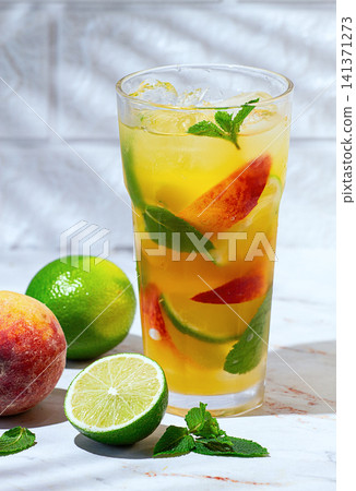 Refreshing soft drink, peach mojito, on a marble table, with ingredients, sunlight, no people, Refreshing soft drink, peach mojito, on a marble table, with ingredients, sunlight, no people, 141371273