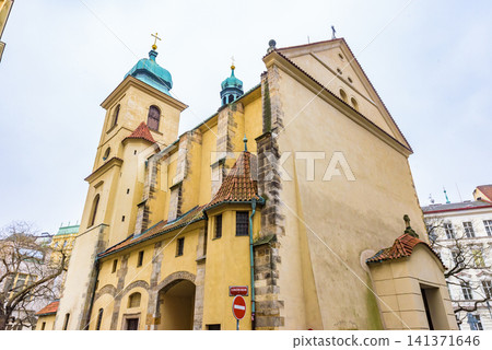The exterior of the Church of the Holy Spirit, a Gothic-style church that exudes a historical atmosphere, in the historic district of Prague, a UNESCO World Heritage Site. 141371646