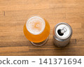 Tulip Beer Glass Beside Opened Can 141371694