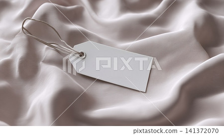 A blank apparel tag presented on smooth silk fabric, with ample room for custom text or design A blank apparel tag presented on smooth silk fabric, with ample room for custom text or design 141372070