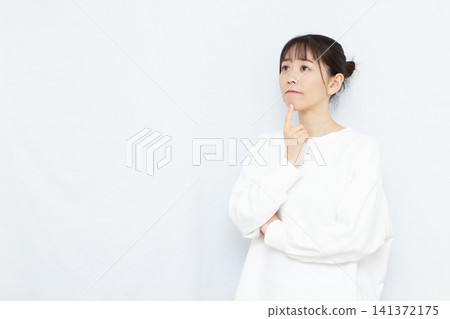 A woman who is seriously worried A woman who is seriously worried 141372175