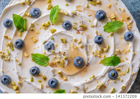 Rustic No Bake Mascarpone Cheesecake Topped With Blueberries Pistachios Maple Syrup And Mint Rustic No Bake Mascarpone Cheesecake Topped With Blueberries Pistachios Maple Syrup And Mint 141372209