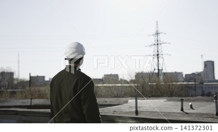 Field Engineer Performs Comprehensive Assessment Of Electrical Grid Systems And Urban Utilities. Media Field Engineer Performs Comprehensive Assessment Of Electrical Grid Systems And Urban Utilities. Media 141372301