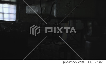 Industrial Setting With Tools. Quiet Repair Area With Suspended Power Cords And Worn Metal Surfaces. Media 141372365