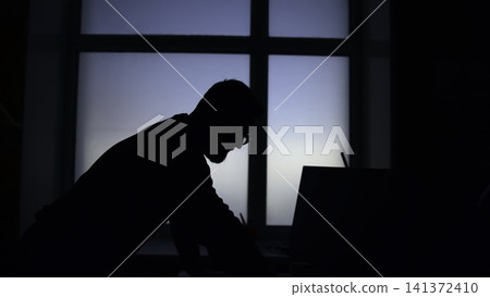 Focused Man Negotiating Over Laptop With Client. Professional At Desk Engaged In Critical Client Discussion . Media 141372410