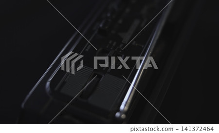 Detailed Shot Of Person Adjusting Sound Controls On Studio Equipment Interface In Low Lighting Conditions. Media Detailed Shot Of Person Adjusting Sound Controls On Studio Equipment Interface In Low Lighting Conditions. Media 141372464