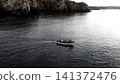 Small Patrol Vessel Navigating Near Cliffs With Crew Ensuring Maritime Safety And Rescue Efficiency . Media 141372476