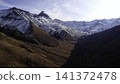 Snowy Peaks And Shadowed Valleys. Drone Captures Serene Wilderness With Dramatic Lighting And Shadows . Media 141372478