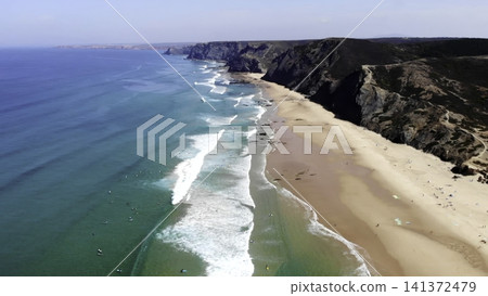 Sea Cliffs Sparkle. Vast Ocean Meets Rugged Shoreline. Bright Sunlight Highlights Shimmering Ocean Waves . Media Sea Cliffs Sparkle. Vast Ocean Meets Rugged Shoreline. Bright Sunlight Highlights Shimmering Ocean Waves . Media 141372479