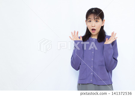 Surprised and amazed woman Surprised and amazed woman 141372536