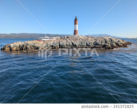 Ushuaia, Tierra del Fuego, Argentina - March 6, 2026: Tour Boat Beside Les Eclaireurs Lighthouse 141372825