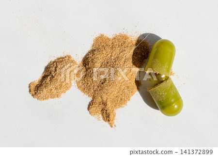 Green pills, herbal medicine capsules with herb powder Green pills, herbal medicine capsules with herb powder 141372899