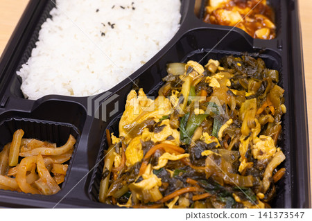 Delicious Chinese bento box with stir-fried mustard greens and eggs Delicious Chinese bento box with stir-fried mustard greens and eggs 141373547